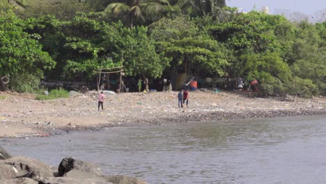 People-walking-on-polluted-beach