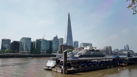 Iconic-Tower-Millennium-Pier-overlooking-the-majestic-Shard-in-London,-England,-capturing-the-essence-of-urban-elegance-and-architectural-grandeur