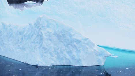 Antarctica-Iceberg-Ice-Formation-Floating-in-Ocean-Close-Up,-Blue-Antarctica-Icebergs-with-Amazing-Shapes-in-Antarctic-Peninsula-Sea-Water-in-Winter-Seascape,-Iceberg-Detail-in-Icy-Seascape-Landscape