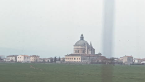 Townscape-in-the-Outskirts-with-Classical-Buildings-Surrounded-by-Green-Fields