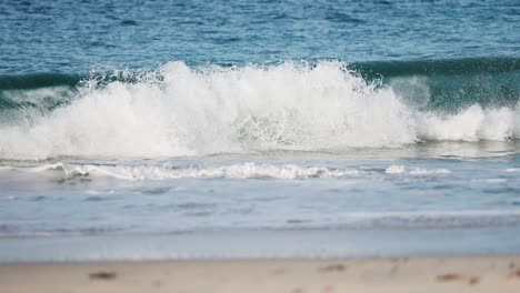 Waves-roll-and-crash-on-the-sandy-beach