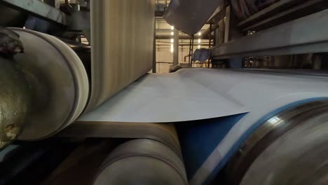 close-up-seen-inside-which-the-paper-rolls-are-poured-and-wrapped-inside-the-big-roll