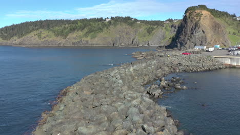 Port-Orford,-Oregon.-Drone-fly-over-jetty-rocks