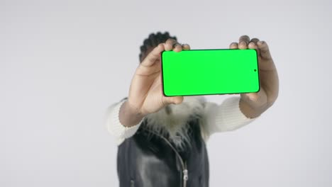 A-man-shows-a-cell-phone-in-a-green-screen-for-an-office-worker-illustration