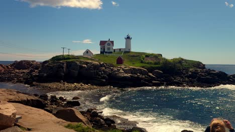 People-looking-at-Nubble-Lighthouse,-Sohier-Park,-York,-Maine