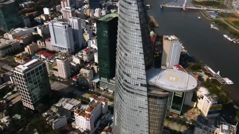 Aerial-view-around-the-Saigon-Skydeck,-in-Ho-chi-minh,-Vietnam---circling,-tilt,-drone-shot