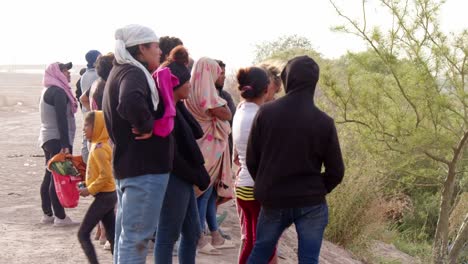 Hopeful-Faces:-Families-Await-Fate-at-El-Paso-Border-Wall