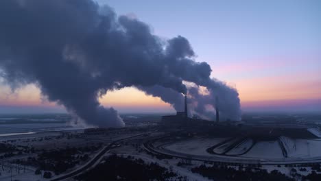 Orbiting-drone-shot-of-the-Sherburne-County-Generating-Station-as-the-sun-sets-in-the-background