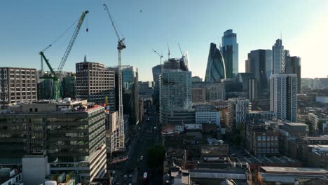 Aerial-Drone-Helicopter-view-of-the-cranes-to-build-new-skyscrapers-in-the-City-of-London-with-city-of-London-in-background