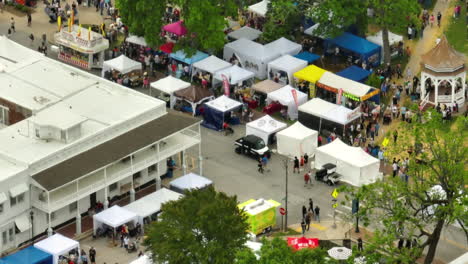 Crowd-Of-People-And-Booths-At-Venue-Of-50th-Dogwood-Festival-Near-Sager-Creek-In-Siloam-Springs,-Arkansas