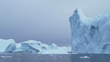 Amazing-Shapes-of-Big-Blue-Icebergs,-Antarctica-Ocean-Seascape-Scenery-of-Massive-Bizzare-Beautiful-Icebergs-Floating-in-Sea-Water-in-Cold-Winter-Scene,-Amazing-Nature-in-Dramatic-Scenery