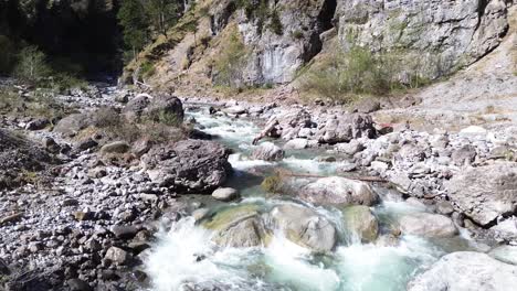 River-with-Crystal-Clear-Turquoise-Water-in-Mountain-Valley-in-Austria,-Europe