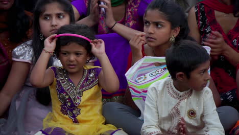 Indian-American-children-watch-and-applaud-dance-performance