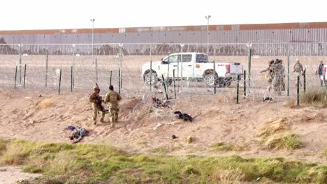 Tense-Confrontation:-Border-Patrol-Secures-Fence,-Detains-Group