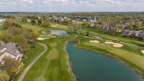 Large-houses-in-country-club-neighborhood-on-bright-spring-day