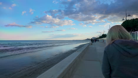 A-seaside-promenade-with-people-walking-along-the-path-by-the-water-in-Larnaka