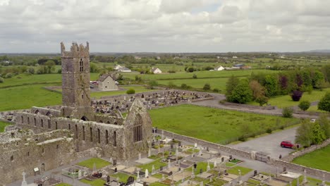 Claregalway-Friary-and-cemetery-with-large-tombstones-push-in-to-center-tower