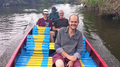 Tourist-on-boat-visit-Ramang-Ramang-village,-Maros,-South-Sulawesi