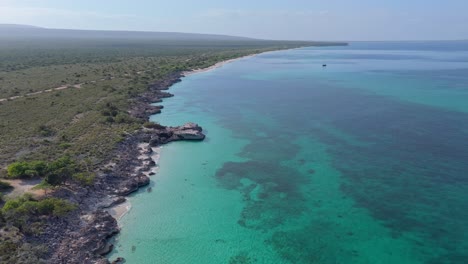 Endless-Caribbean-coastline-in-the-Dominican-Republic,-aerial-dolly-forward