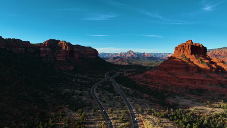 Highway-And-Red-Rocks-In-Sedona,-Arizona,-USA---Aerial-Drone-Shot