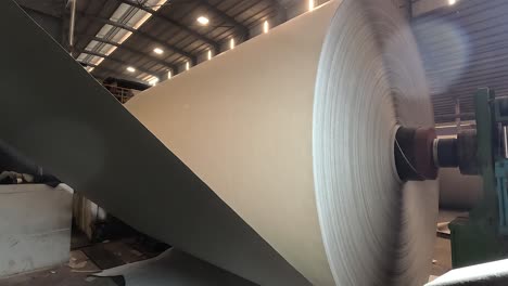 Making-a-roll-of-paper-from-inside-a-big-machine