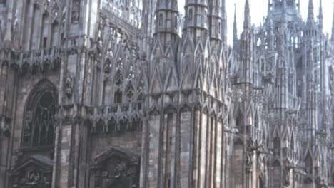 Milan-Cathedral-Street-Scene-With-Pedestrians-Under-a-Cloudy-Sky-of-1950s