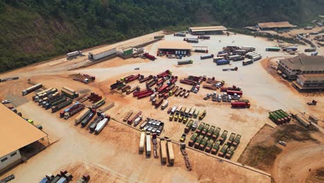 Aerial-shot-of-empty-trucks-stopped-at-the-transportation-hub-in-Boten-Economic-Zone