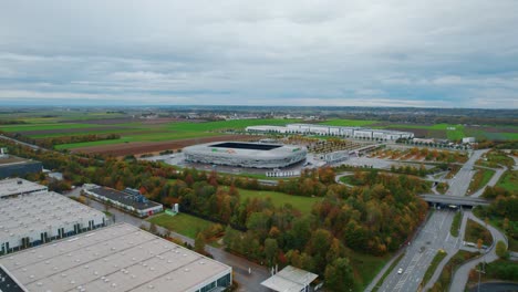 Aerial-360-View-Of-WWK-Arena-Stadium-Home-To-FC-Augsburg-Beside-B17-Dual-Carriageway