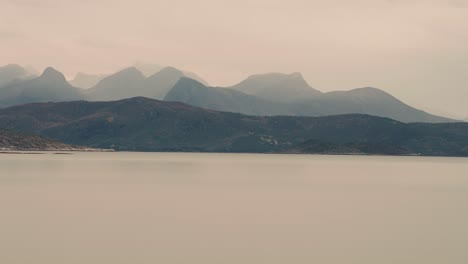 Mountainous-fjord-cost-wrapped-in-thick-fog