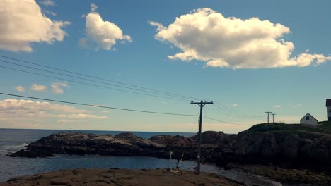 Tourists-taking-pictures-of-Nubble-Lighthouse,-York,-Maine