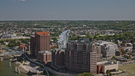 Cincinnati-Ohio-Aerial-v4-cinematic-drone-flyover-the-river-capturing-Covington-cityscape,-views-of-Newport-hillside-landscape-and-bridges-crossing-at-daytime---Shot-with-Inspire-3-8k---September-2023