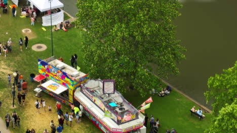 Food-Stalls-And-Booths-By-The-Sager-Creek-With-People-Walking-At-50th-Dogwood-Festival-In-Siloam-Springs,-Arkansas