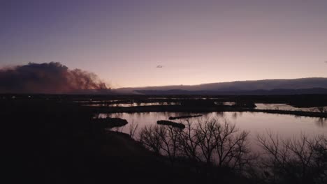 Drone-Aerial-View-Of-Marshall-Fire-In-Boulder-County-Colorado-Wildfire-Smoke-At-Golden-Hour-Evening-Time