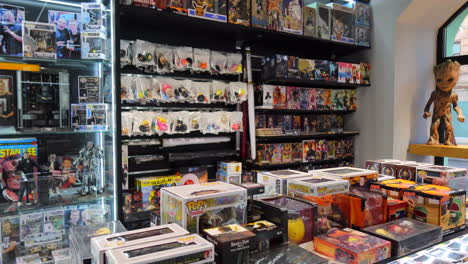 Comic-book-store-in-Kyiv-city-Ukraine,-toys-and-comics-for-sale,-4K-shot