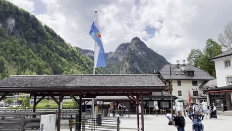 Tourists-strolling-around-the-small-harbor-in-the-village-of-Schönau-at-the-picturesque-lake-Königssee-near-Berchtesgaden-in-the-Bavarian-Alps