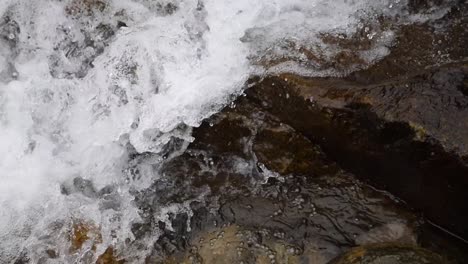 Crisp-footage-of-water-flowing-down-rocks