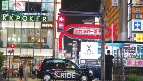 Slow-motion-pan-at-night-over-red-gates-of-Kabukicho-District