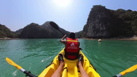 A-tourist-boating-Kayaking-moving-over-water-in-a-islan