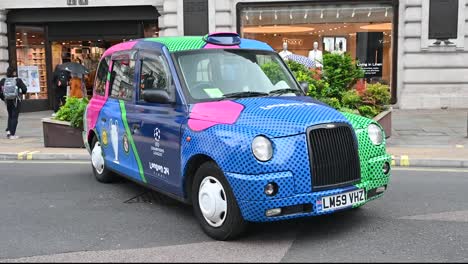 Colourful-Taxi-from-Regents-Street-to-the-UEFA-Champions-League-in-Wembley,-London,-United-Kingdom