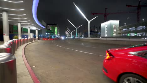 Los-Angeles-LAX-airport-drop-off-at-night-with-cars-driving