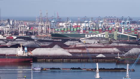 Aerial-view-raw-material-heaps-and-loaded-container-ships