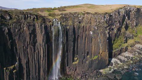 Aerial-Pullback-Revealing-Steep-Coastal-Cliffs-and-Kilt-Rock-Waterfall