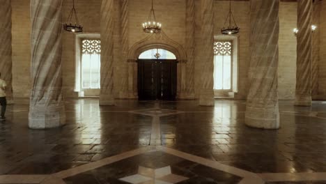 Entering-The-Llotja-de-la-Seda-Gothic-Medieval-style-building-main-hall-in-Valencia-Spain-wide-shot