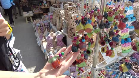 Close-up-shot-of-a-woman's-hand-touching-a-souvenir-at-a-local-market-in-Cappadocia-turkey