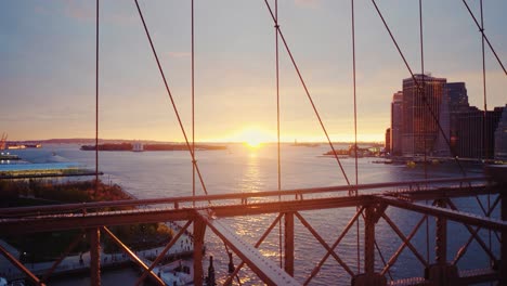 Sunset-From-Iconic-Brooklyn-Bridge-Walking-Path-On-A-Warm-Autumn-Day-Steady-Shot