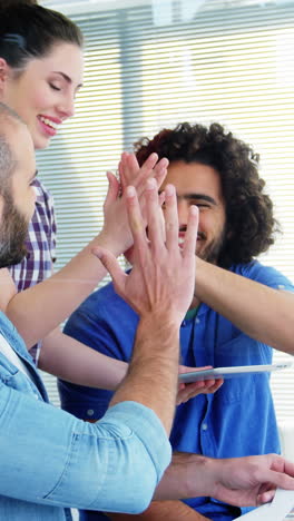 Graphic-designer-giving-high-five-to-each-other