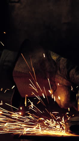 Female-welder-working-at-work-shop