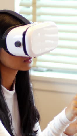 Woman-using-virtual-reality-headset-in-living-room