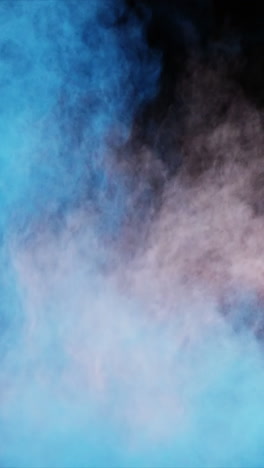 Blue-and-white-dust-powder-blowing-against-black-background