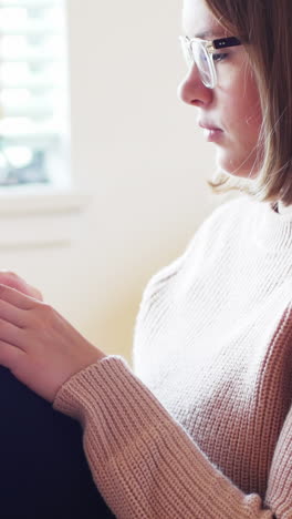 Beautiful-woman-using-digital-tablet-in-living-room